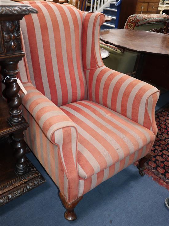 A pair 1920s upholstered wing armchairs